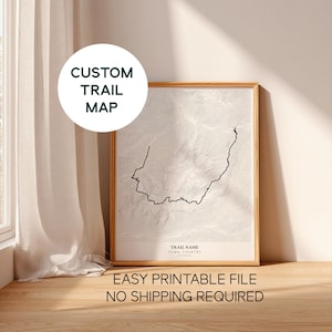 May include: A framed custom trail map with a topographic design in black and white. The text "CUSTOM TRAIL MAP" is in a white circle. The text "EASY PRINTABLE FILE NO SHIPPING REQUIRED" is at the bottom.