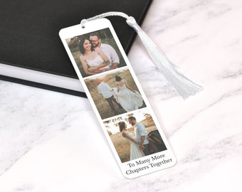 May include: White bookmark with a tassel featuring three photos of a couple in a field. The text "To Many More Chapters Together" is printed at the bottom.