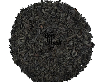 May include: Loose black tea leaves, a popular choice for brewing a hot beverage.