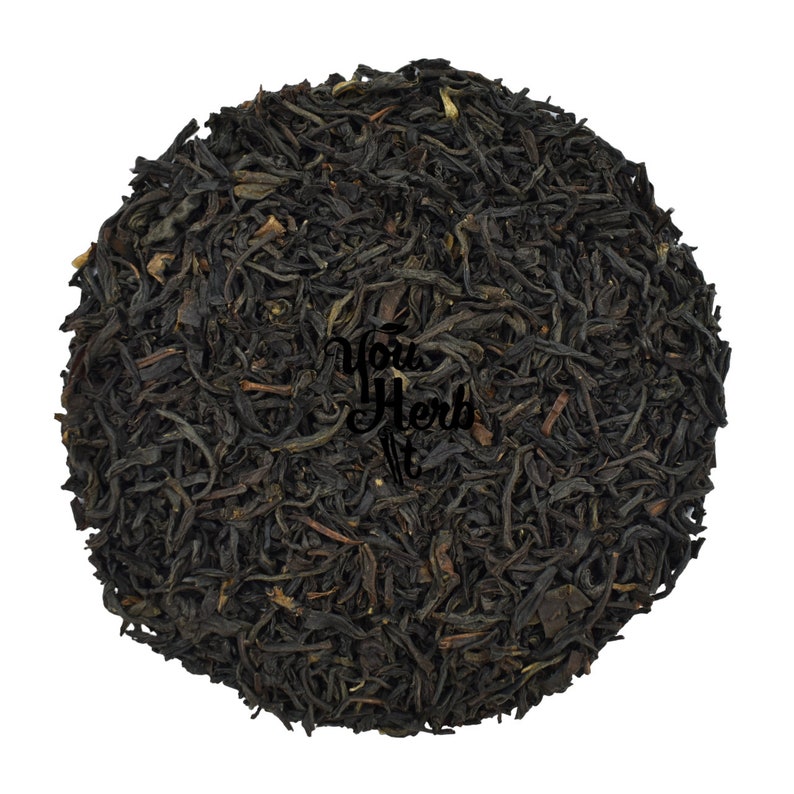 May include: Loose black tea leaves, a blend of black tea and other ingredients, for brewing a cup of tea.