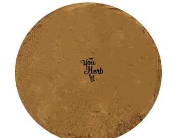 May include: A close-up view of a pile of ground cinnamon. The cinnamon is a light brown color and has a fine texture. The text "You Herb It" is printed in black on a white background in the center of the image.