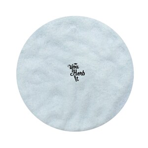May include: A light blue round disc with the text "You Herb It" in black lettering.