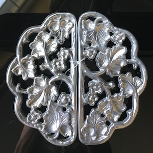 May include: A set of three ceramic mugs with a speckled, matte finish. The mugs are in shades of cream, light gray, and dark gray. Each mug has a simple, minimalist design, perfect for coffee or tea.