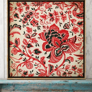 May include: A framed print of a vintage floral pattern in red, black, and white. The design features intricate flowers and leaves on a cream background.
