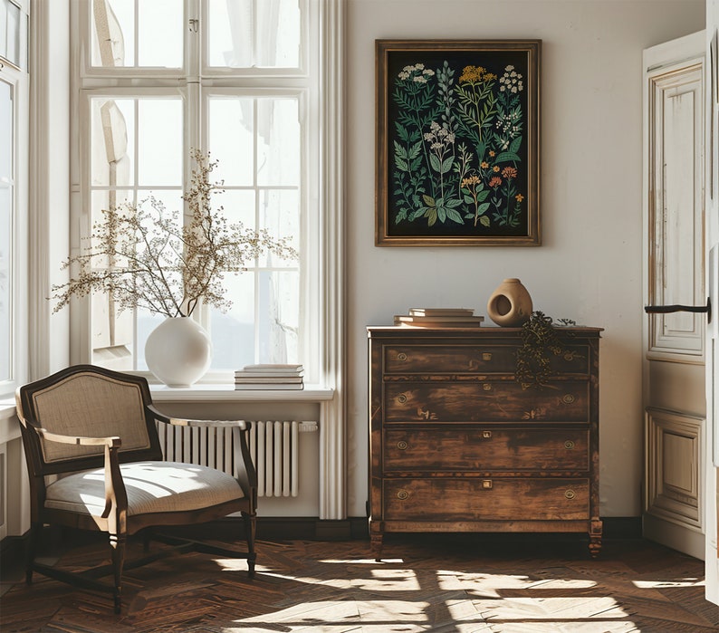 May include: A vintage-style chest of drawers with four drawers, a light wood finish, and brass hardware. The chest of drawers is in a room with a large window, a chair, and a framed botanical print on the wall.