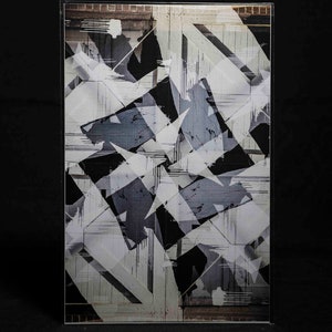 May include: Abstract art print with a geometric design in black, white, and gray. The design features overlapping shapes and lines, creating a sense of depth and movement.
