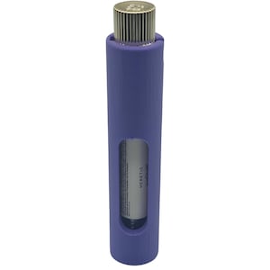 May include: A cylindrical, periwinkle-colored product with a silver-colored, ribbed cap. The product has a rectangular window revealing a white label with the word "HERETIC" printed on it. The product is a fragrance or cosmetic item.
