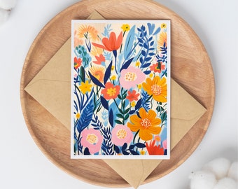 May include: A card with a colorful floral pattern. The flowers are painted in shades of pink, orange, yellow, blue, and green. The background is a light cream color.