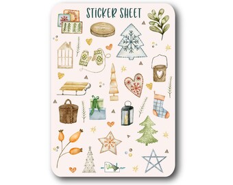 May include: A sticker sheet with a variety of winter-themed illustrations, including a Christmas tree, a sled, a lantern, mittens, a star, a heart, a basket, and a house. The sheet is labeled "Sticker Sheet".