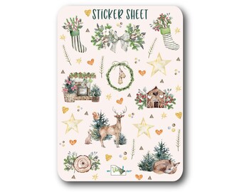 May include: A sticker sheet with a variety of Christmas-themed illustrations, including a deer, a fox, a gingerbread house, a wreath, a stocking, and a bow. The stickers are on a light pink background with gold stars, hearts, and triangles.