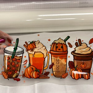 May include: Four illustrated fall-themed beverages with whipped cream and pumpkin accents. The beverages are in cups and mugs with straws and lids.