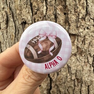 Game Day Button Alpha Omicron Pi Watercolor Football Pink Gingham Background Small, Medium, Large
