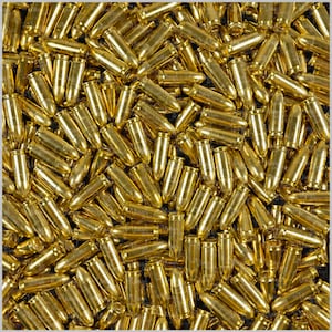 May include: A close-up image of a large quantity of gold-colored bullets.