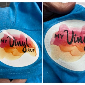 Puede incluir: Una superficie de tela azul brillante con una pegatina circular que presenta un fondo estilo acuarela en tonos rosa, naranja y amarillo. El texto negro en la pegatina dice My Vinyl Cut, con la palabra Vinyl en una fuente cursiva.