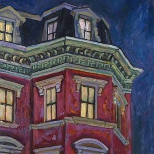 May include: A red brick building with a green trim and several windows with lit lights inside. The building has a dark blue roof and is set against a dark blue sky.