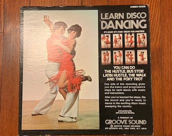 May include: A record album cover featuring a couple dancing in the foreground. The album cover is for a record titled "Learn Disco Dancing" and features the text "It's easy! It's fun! Great for parties!"  The album cover also features a series of smaller images of couples dancing, and the text "You can do the Hustle, Bus Stop, Latin Hustle, The Walk and the Foxy Trot".