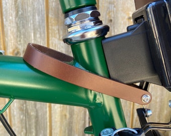 Front carrier block strap for Brompton