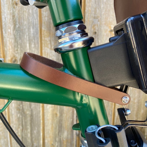 Front carrier block strap for Brompton