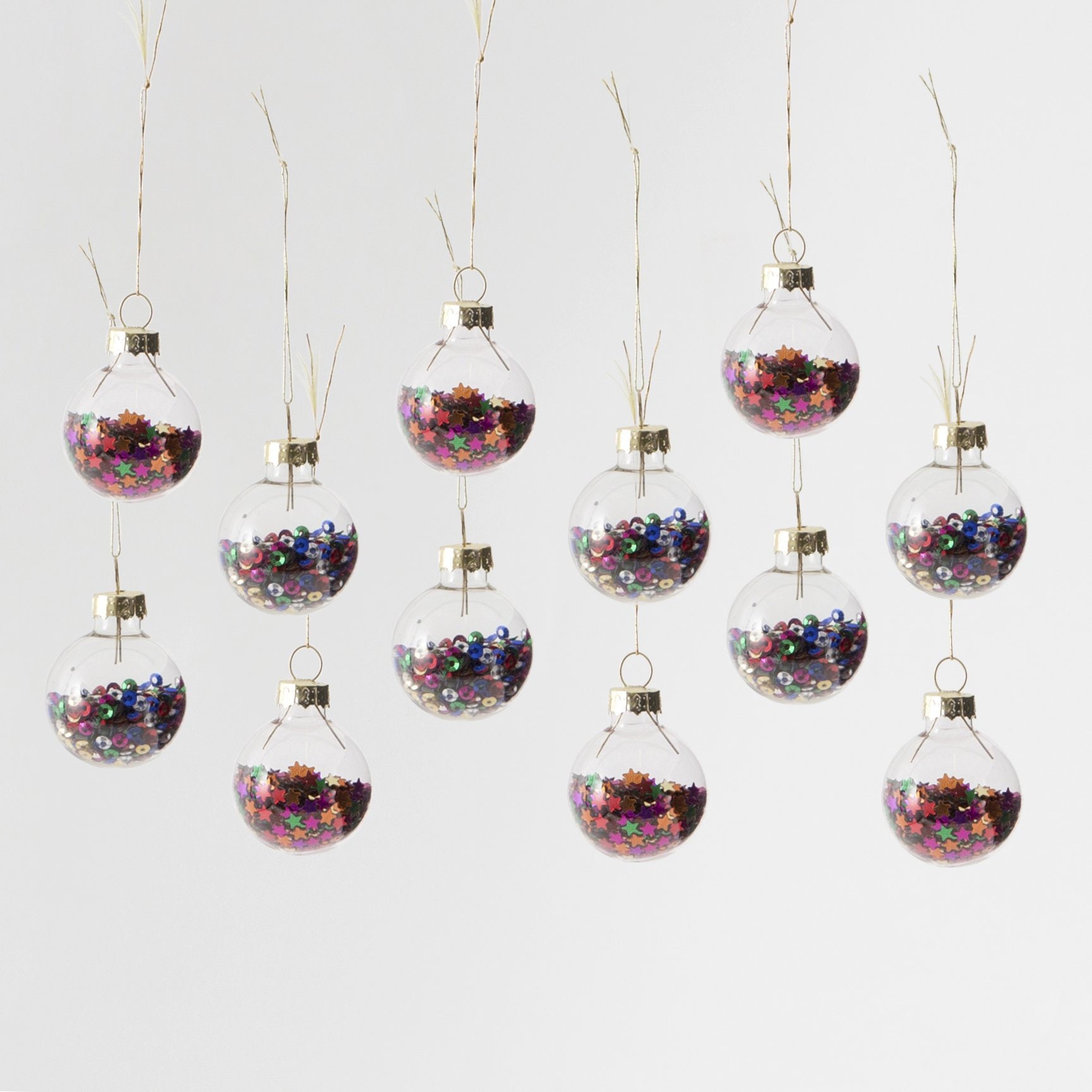 Set of 12 Star Filled Glass Baubles Set of 12 Star Filled Glass Baubles