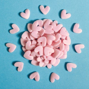 Pink jumbo heart shaped edible cake sprinkles.