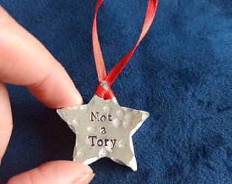 Not a Tory star shaped Christmas tree decoration. Hand stamped.