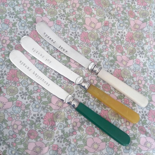 3 spread knives. Handstamped vintage silver plate with bakelite. spread love, spread joy, spread happiness. Reuse, recycle, relove