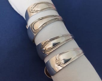 set of 4 napkin rings repurposed from vintage silver plated small spoons. Tableware
