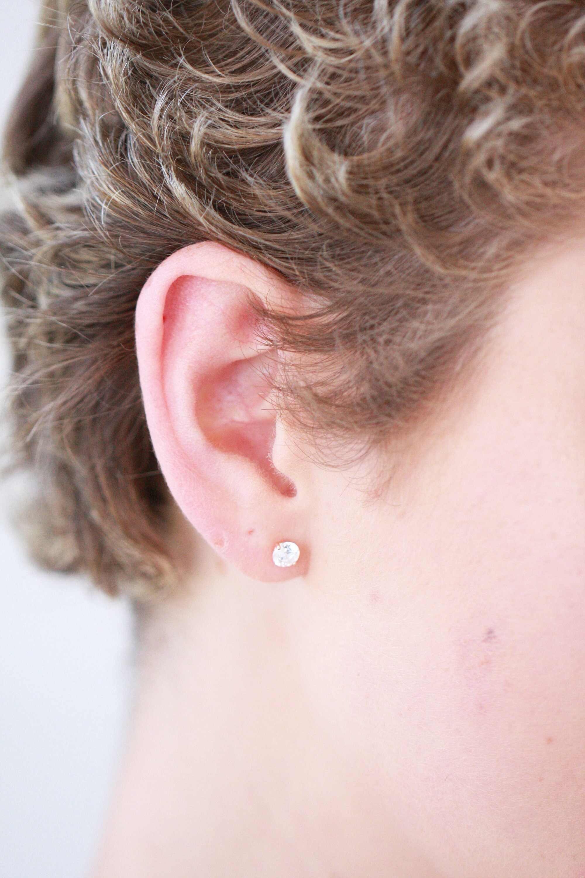 Sterling Silver 5mm Round Hoop Earrings and a pair of 4mm CZ Stud Earrings Sterling Silver 5mm Round Hoop Earrings and a pair of 4mm CZ Stud Earrings