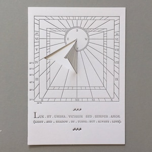 Light and shadow by turns, but always love. Latin. Sundial Motto. Working sundial card.