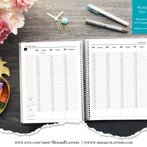 May include: A spiral-bound planner open to a weekly view, with time increments of 15 minutes. The planner includes a calendar for January 2024 and the text "Weekly View". Pens and decorative paper clips are visible.