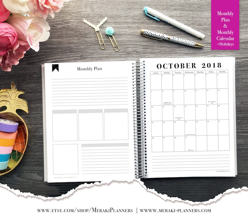 May include: Open spiral-bound planner with a monthly plan and calendar for October 2018. The planner includes lined pages and boxes for notes. The text "Monthly Plan & Monthly Calendar + Holidays" is visible. Pens and decorative paper clips are also present.