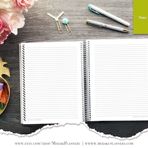 May include: Open spiral-bound notebook with lined pages, black and white striped border, and silver spiral binding. Includes pens, paper clips, and a small green notepad labeled "Notes". Decorative gold pineapple-shaped container with colorful washi tape and pink and white flowers.
