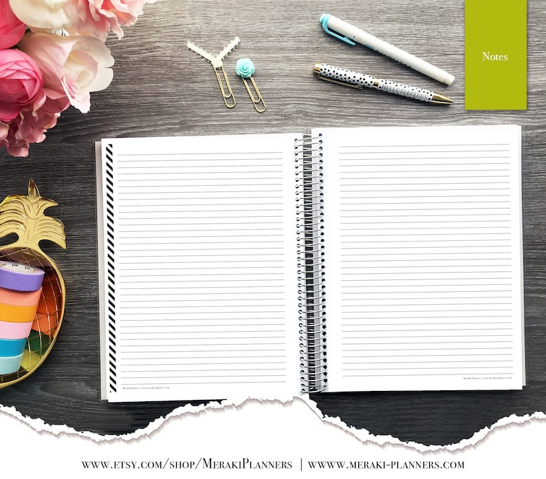 May include: Open spiral-bound notebook with lined pages, black and white striped border, and silver spiral binding. Includes pens, paper clips, and a small green notepad labeled "Notes". Decorative gold pineapple-shaped container with colorful washi tape and pink and white flowers.