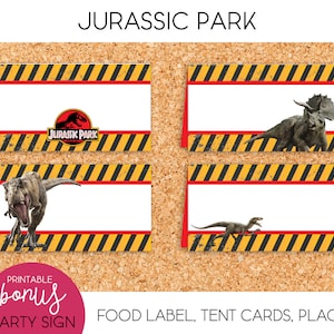 May include: Four printable Jurassic Park party signs with dinosaur illustrations. Each sign features a white rectangular space for text, bordered by red and black hazard stripes. The Jurassic Park logo is on one sign. The signs are on a corkboard.