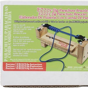 May include: A wooden tool for making parachute cord bracelets. The tool is called "EZZZy-Jig" and is made in China. The tool is shown with blue parachute cord threaded through it. The packaging includes instructions for making bracelets.