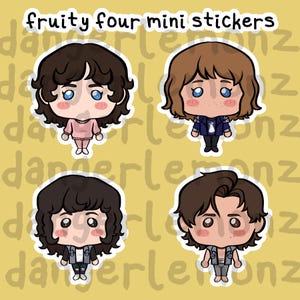 May include: Four mini stickers featuring cartoon characters with brown hair and various outfits. The stickers have a white border and are set against a yellow background with the text "fruity four mini stickers" at the top.