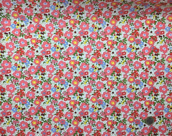 Cotton poplin with coral pink floral on off white