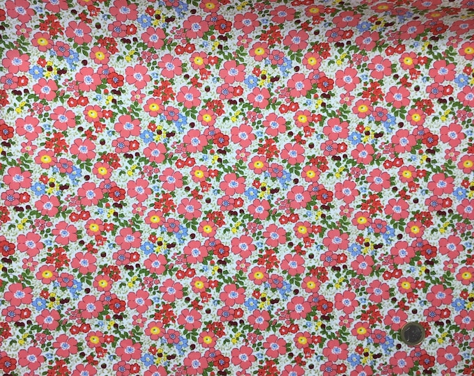 Cotton poplin with coral pink floral on off white