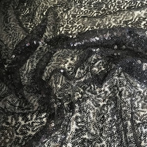 Light tulle dress fabric embroidered with small sequins, black