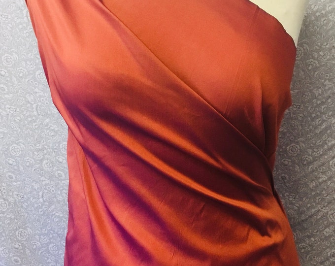 Two tone, iridescent faux taffetas dupioni silk fabric. Rust/cobalt col39
