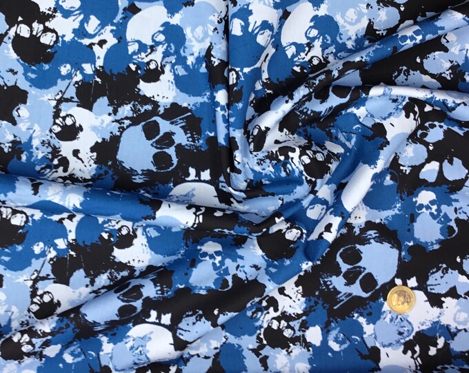 Cotton poplin with skulls on blue