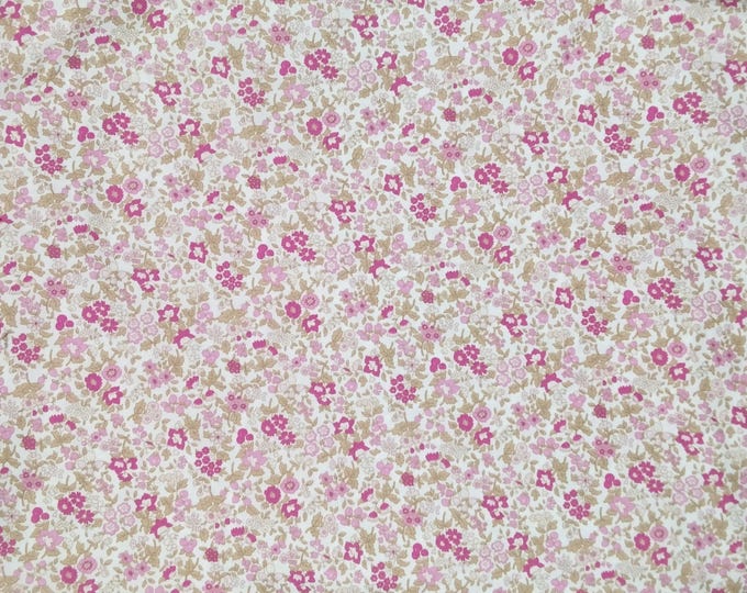 Cotton poplin with pink flowers with beige foliage