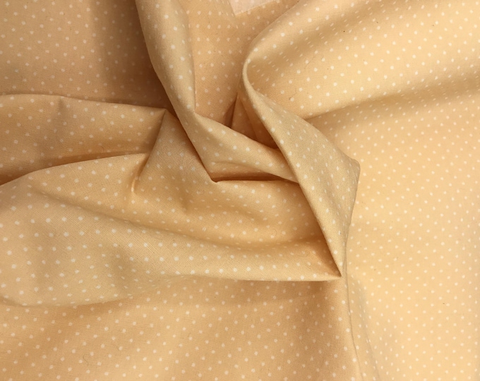 High quality cotton poplin, 1mm polka dots on sable yellow