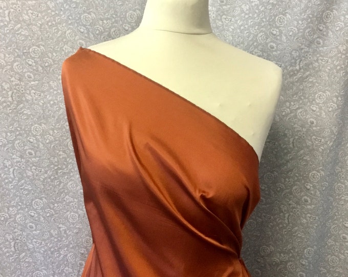 Two tone, iridescent faux taffetas dupioni silk fabric. Copper/black nr38