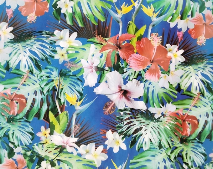 Cotton poplin with jungle flowers on blue