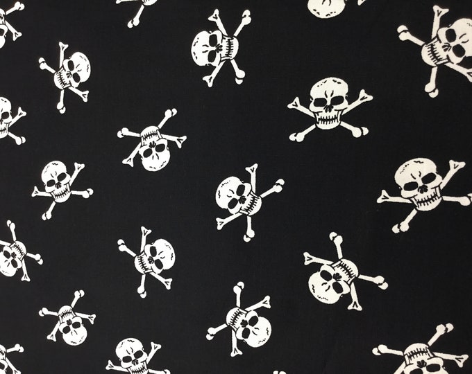 Cotton poplin with skeletons, skulls on black