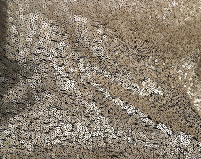 Light tulle dress fabric embroidered with small sequins, mat nude or champagne