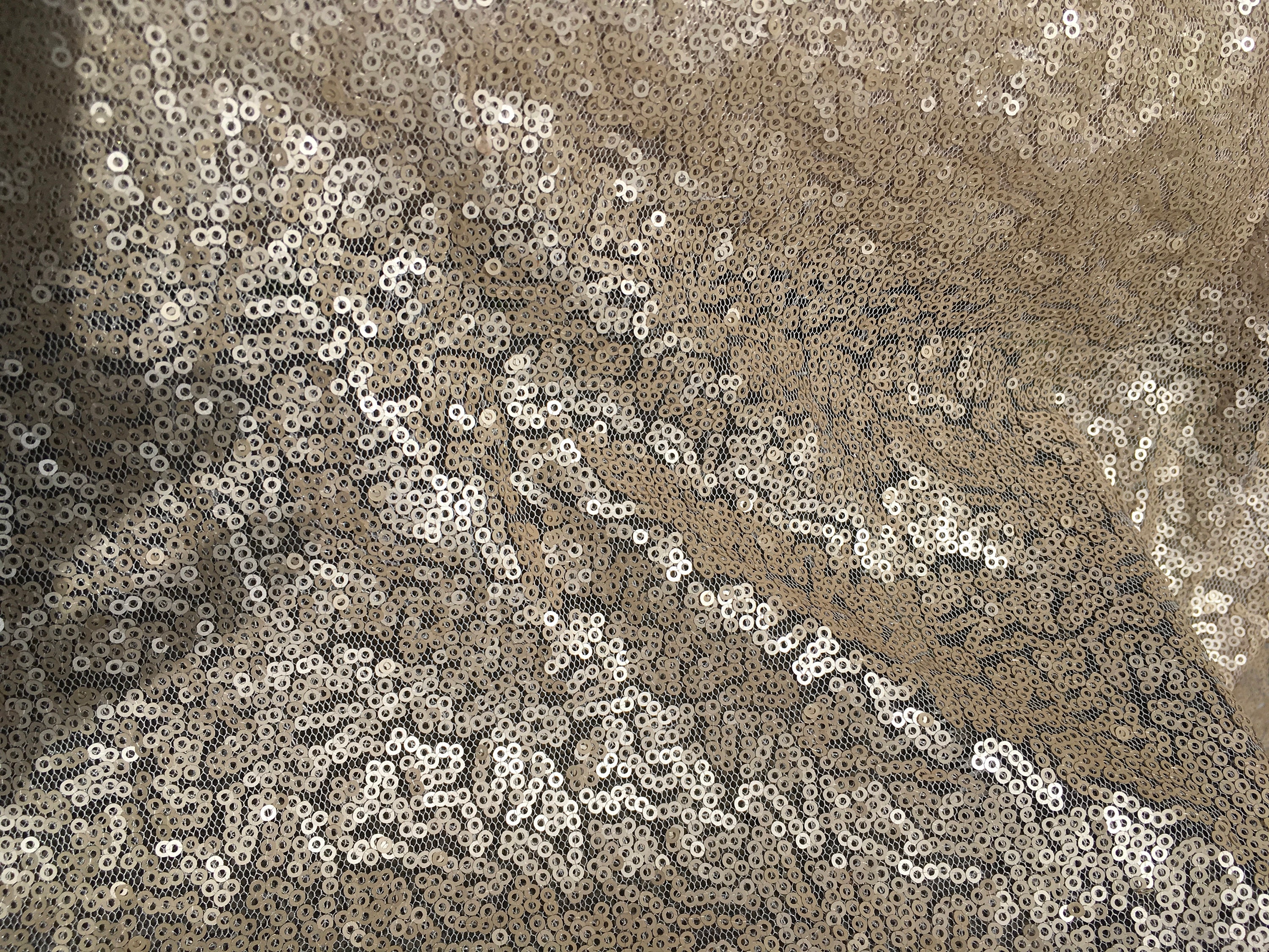 Light tulle dress fabric embroidered with small sequins, mat nude or ...