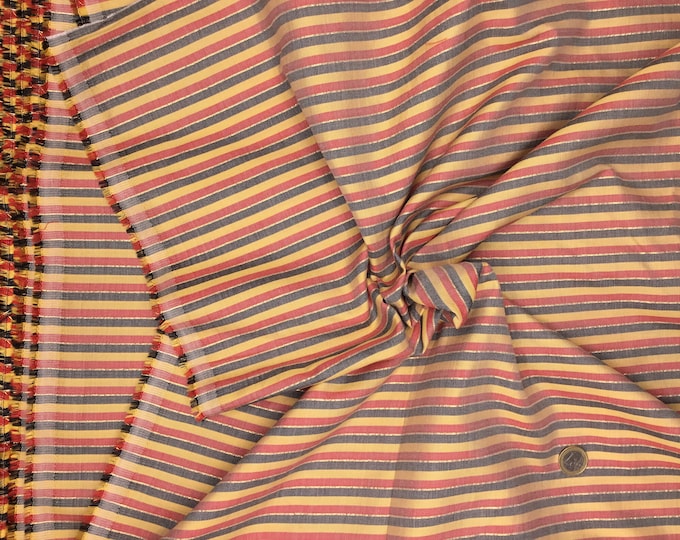 Indian hand made woven cotton fabric with metallic stripes.