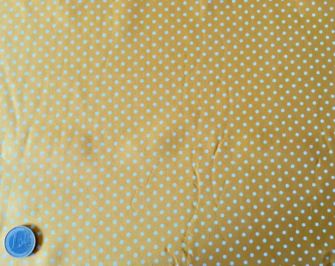 High quality cotton poplin dyed in Japan with 3mm polka dots on yellow